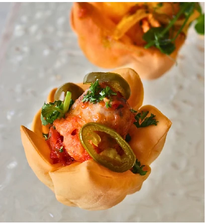 Sausage tomatoes sauce & jalapeno from the Choijin finger food special set menu.